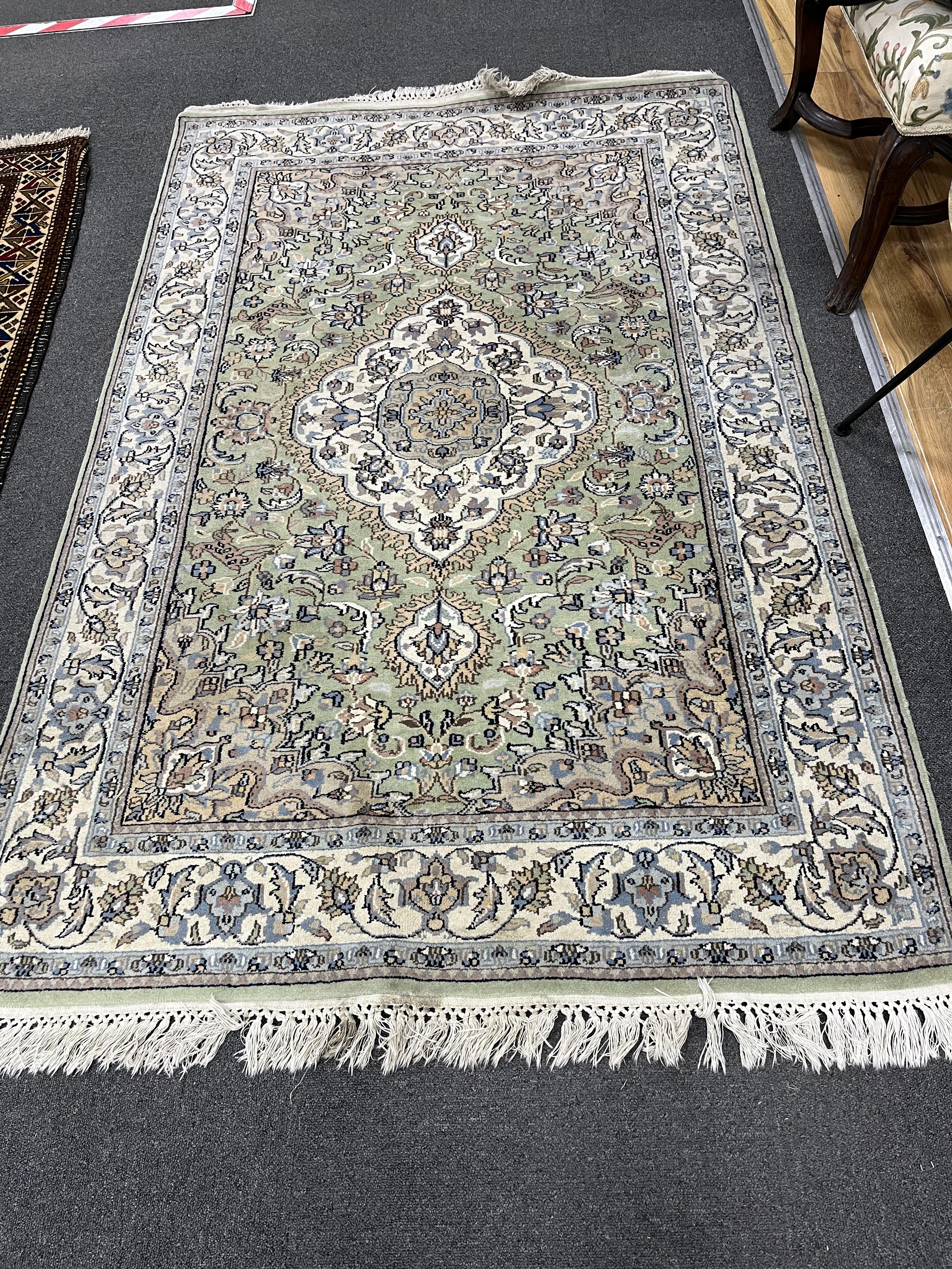 A North West Persian pale green ground rug, 180 x 120cm
